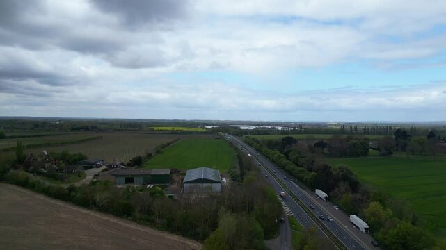 High Angle British Agricultural Farms at Gorgeous Countryside Landscape of England Great Britain of United Kingdom. Footage Was Captured with Drone's Camera from Medium High Altitude