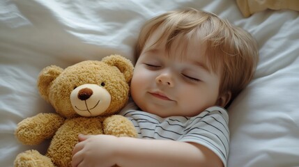 Toddler sleeping peacefully embracing teddy bear in white bed