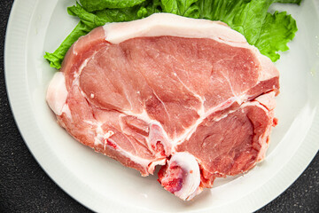 Pork on bones raw meat fresh tasty food dish delicious gourmet food background on the table rustic food top view copy space