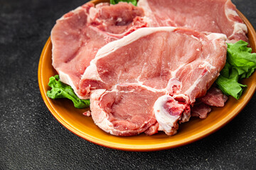 Pork on bones raw meat fresh tasty food dish delicious gourmet food background on the table rustic food top view copy space