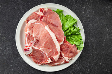Pork on bones raw meat fresh tasty food dish delicious gourmet food background on the table rustic food top view copy space