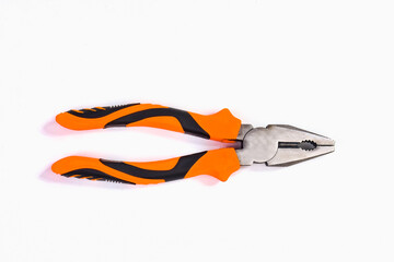 Pliers with black orange rubber handle isolated on white background