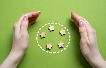 Hands guard the stars in the circle. Team members and organization members. Teamwork, unity, and...