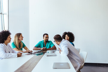 Team Collaborating Around a Table in a Bright Office Space