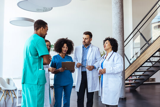 Group of Medical Professionals Collaborating in a Modern Clinic Environment