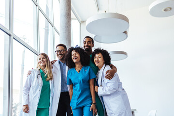 Diverse Group of Happy Healthcare Professionals Smiling Together in Modern Office Space