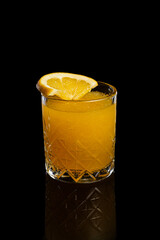 Homemade orange lemonade on a dark background