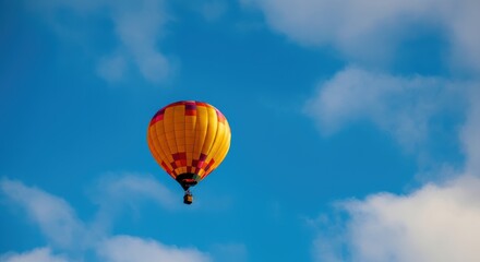 Naklejka premium Colorful hot air balloon soaring against a clear blue sky