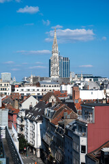 Fototapeta premium Town hall gothical tower and contemporary finance tower in the background, high angle view of Brussels old town, Brussels Capital Region, Belgium. March 16, 2025