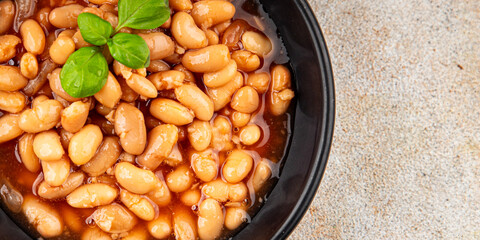 White bean tomato sauce gourmet food background on the table rustic food top view copy space