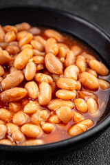 White bean tomato sauce gourmet food background on the table rustic food top view copy space