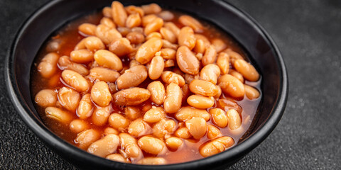 White bean tomato sauce gourmet food background on the table rustic food top view copy space