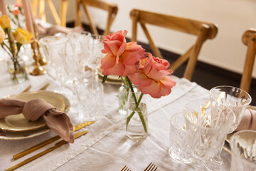 Wedding table setting with flowers.