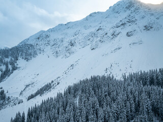 Aerial view of Gantrisch mountains in Swiss alps. Tranquil snow covered landscape.