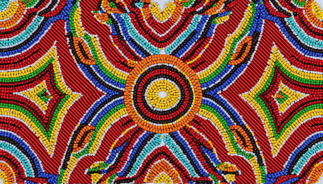 Vibrant Zulu beadwork patterns on textile background, cultural artistry