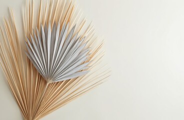 Minimal summer stationery still life with dry silver, golden palm leaves on white neutral background. Blank space for wedding invitation design, mockups, vacation advertisement, web log