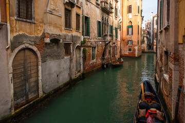 the iconic canals of Venice, winding gracefully between historic buildings