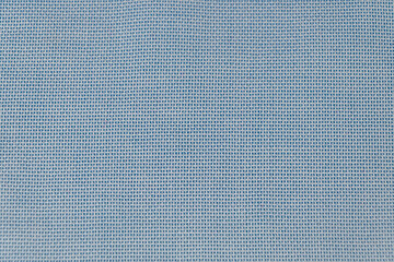 A close-up of blue woven fabric with a uniform grid pattern and a textured surface. Backgrounds