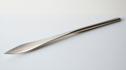 Sleek and Modern Metal Knife with Sharp Edge on Minimalist Background for Culinary and Kitchen Design Inspiration