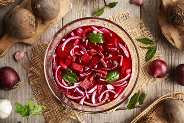 Preparation of fermented beet kvass in a bowl, top view