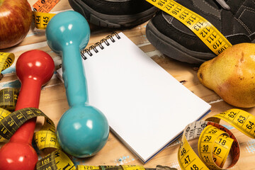 fruit for weight loss with measuring tape and equipment for exercise and diet, weight loss