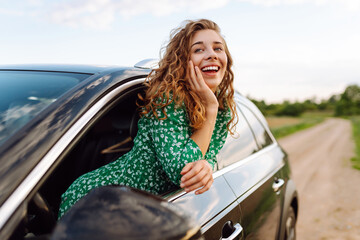 Woman tourist on road, enjoying window view and traveling on holiday road trip. Travel adventure...
