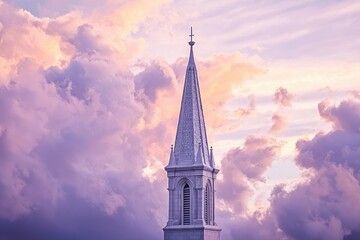 Fototapeta premium Church steeple piercing a breathtaking sunset sky, showcasing serene beauty and faith.