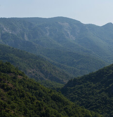 Fototapeta premium Rhodopes, are a mountain range in Southeastern Europe. Bulgaria. Panorama. The forest area covers the mountains.