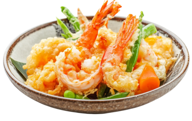 A plate of fresh Japanese tempura with shrimp and vegetables served with dipping sauce Isolated on transparent background PNG
