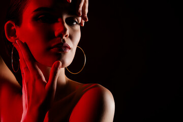 Photo of stunning hot young woman touch head soft skin neon red light shoulders off on black color background