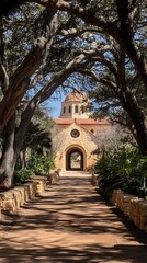 Fototapeta premium Stone Arch Pathway Leading to Church Under Trees