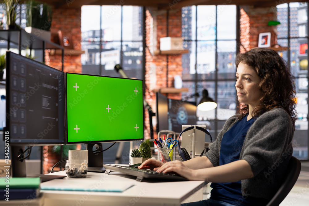 Fototapete Focused person interacting with a chatbot interface next to chroma key, AI system leverages machine learning and automation to generate helpful responses. Improve online data driven workflow.
