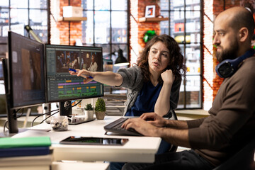 Video editors team working with AI chatbot and montage maker software, editing a background video...