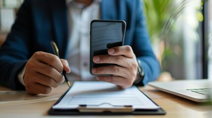 businessman using mobile phone in office