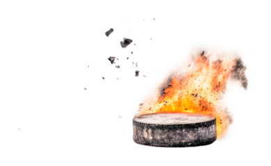 Hockey puck explosion with dramatic flames and debris in motion, cut out