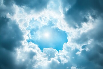 Fototapeta premium Cloudy sky with dark gray clouds and light blue in the center