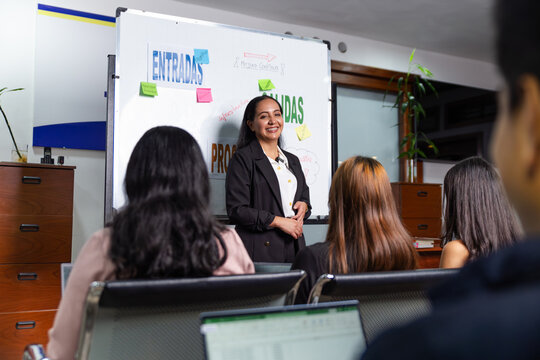 Woman giving an economics lecture