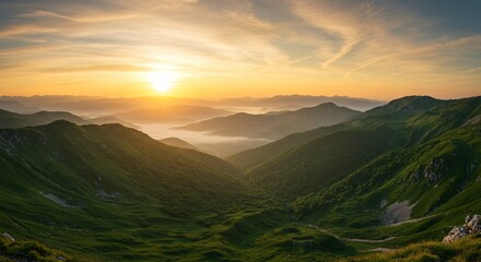 Realistic green mountain landscape at sunset with misty valleys and warm skies