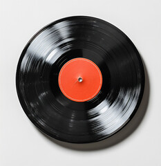 vintage black vinyl record with a red label on a white background,