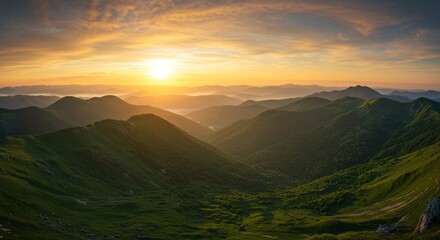 Realistic green mountain landscape at sunset with misty valleys and warm skies