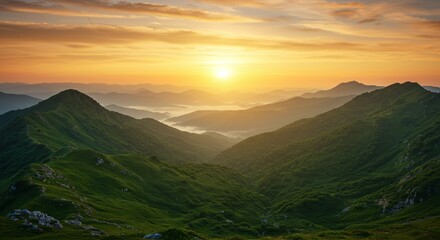 Realistic green mountain landscape at sunset with misty valleys and warm skies