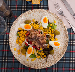 Salad with cod anchovies and sauce tipycal from catalonia