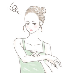 日焼けした腕を触り困った顔をするキャミソールの女性　お団子の髪型