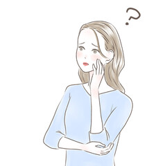 頬杖をついて違和感を感じる女性