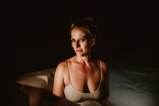 Portrait of woman at night in hot tub image