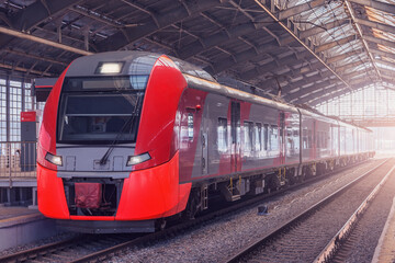 Train stands by the platform.
