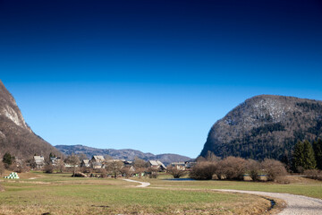 Panoramic view of the village Stara Fuzina in Slovenia's Triglav National Park, featuring...