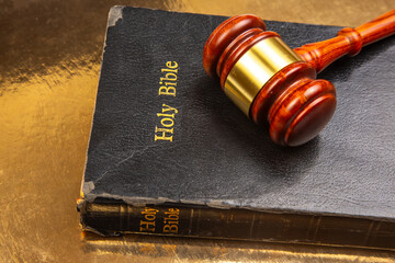 Detailed image of a courtroom gavel resting on a 