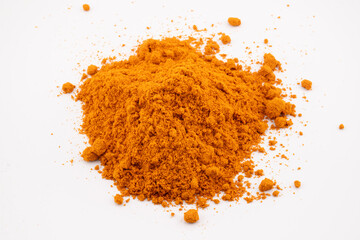 This image captures the rich, golden-orange hues and fine texture of fish curry powder, a key ingredient in flavorful seafood dishes.