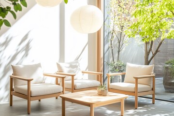 Obraz premium Modern chairs and coffee table in sunlit room, garden view